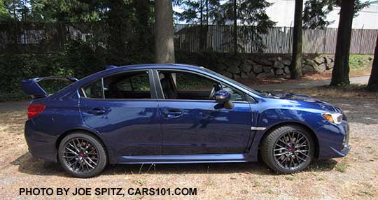 profile view 2016 Subaru Impreza STI 4 door with tall spoiler, lapis blue color