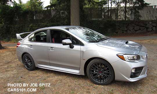 2016 WRX STI with standard black inner headlight surrounds, 18" gray multi-spoke alloys. Ice silver shown