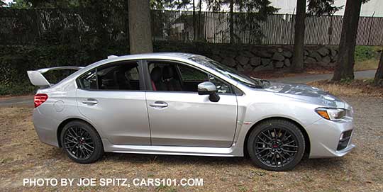 side view 2016 Subaru WRX STI, 18" multi-spoke gray alloysstandard tall rear spoiler