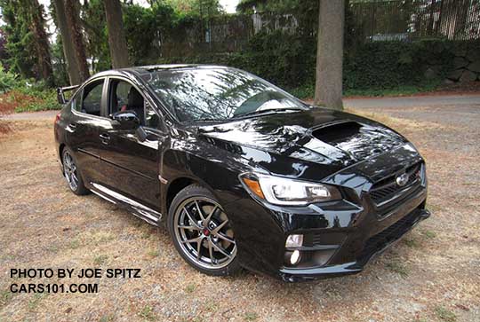 2016 black Subaru WRX STI, tall rear spoiler