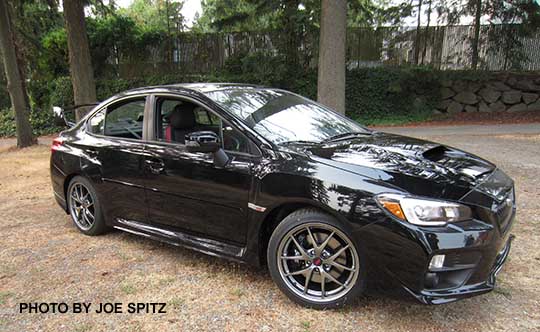 crystal black 2016 Subaru WRX STI, tall sspoiler, rrar aero splash guards, side moldings