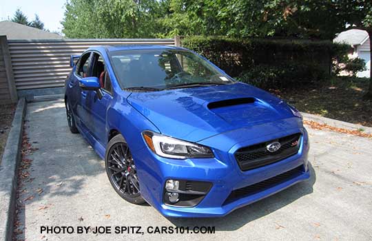 WR Blue 2016 Subaru STI has standard fog lights and  18" gray multi-spoke wheels