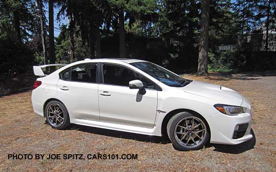 profile view 2016 Subaru Impreza WRX STI Limited, 18" BBS wheels, tall spoiler, crystal white