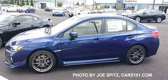 side view 2016 Subaru WRX STI Limited with small rear trunk lip spoiler. Lapis Blue shown.