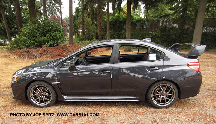 side view dark gray 2016 WRX STI Limited with  tall wing spoiler, 18" BBS alloy wheels