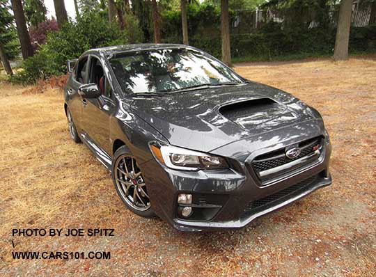 dark gray 2016 WRX STI Limited with  tall wing spoiler