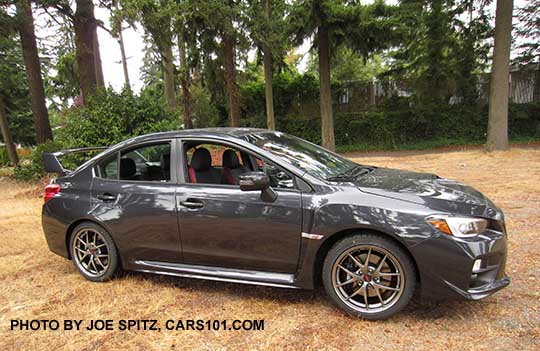 profile view dark gray 2016 WRX STI Limited with  tall wing spoiler