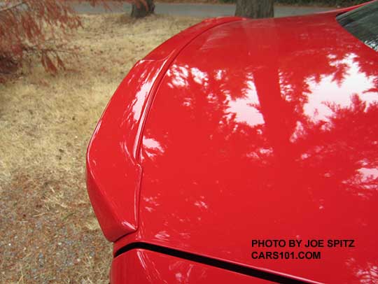 close-up of the new small trunk lip spoiler of the 2016 STI Limited. Pure red color shown