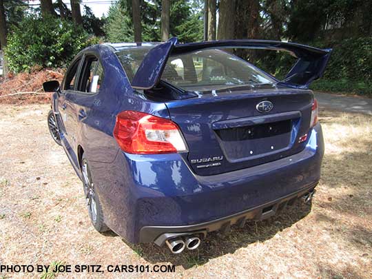 rear quarter view 2016 Subaru WRX STI with tall spoiler, lapis blue shown