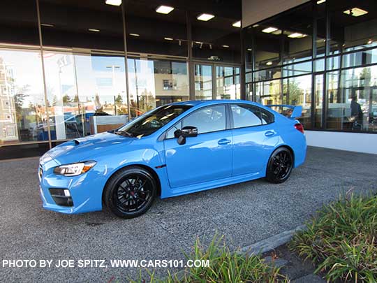 side view 2016 Subaru WRX STI  Series.HyperBlue with standard tall rear spoiler, black 18" BBS STI alloy wheels, black fender log, gloss back outside mirrors...