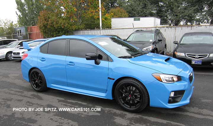 2016 WRX STI Hyperblue with aftermarket dark tinted windows