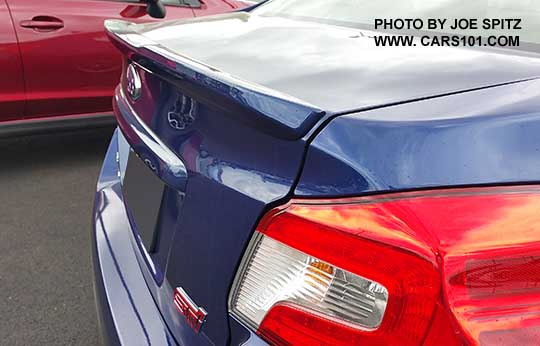 closeup of the 2016 Subaru WRX STI Limited small lip spoiler. Lapis blue