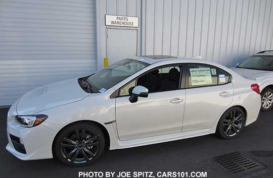 crystal white 2016 WRX Limited has black inner headlight surrounds. Turn signal mirrors means it has optional blind spot detection, possibly Eyesight if a CVT.