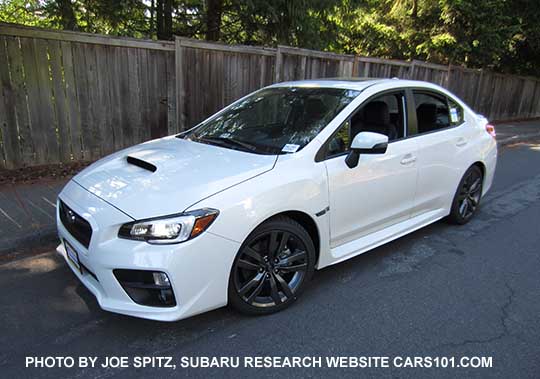 2016 white Impreza WRX Limited has black inner headlight surrounds, 18" gray splitspoke alloys. The turn signal mirrors means it has optional blind spot detection, and possibly Eyesight if a CVT