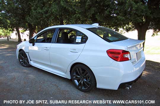 rear view 2016 WRX Limited sedan,  rear lip spoiler, 18" 5 split-spoke gray alloys, crystal white shown