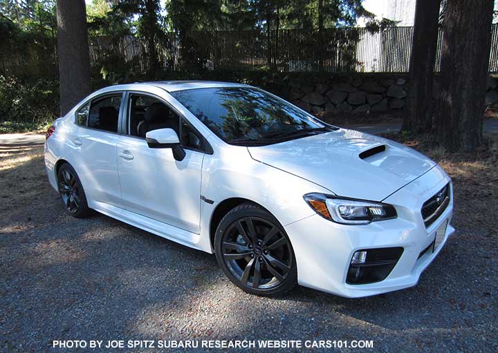 Crystal white 2016 WRX Limited with black inner headlight surrounds, 18" alloys. turn signal outside mirrors means optional blind spot detection, and possibly Eyesight if a CVT