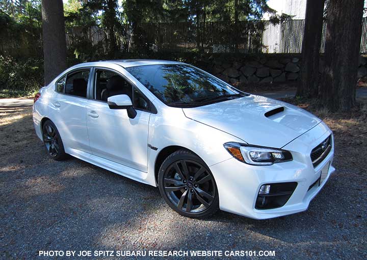 Crystal white 2016 WRX Limited with black inner headlight surrounds, 18" alloys. turn signal outside mirrors means optional blind spot detection, and possibly Eyesight if a CVT