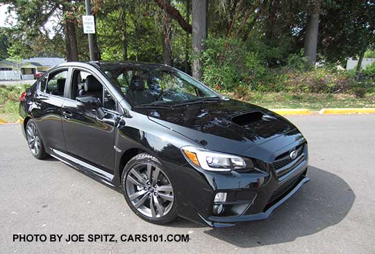 2016 crystal black Subaru WRX Limited with black inner headlight surrounds, fog lights, 18" gray split-spoke alloys