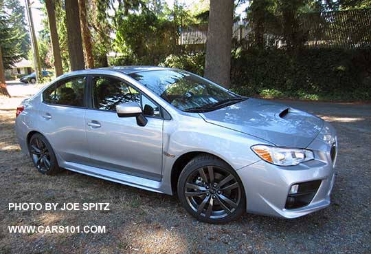 2016 Subaru Premium WRX with silver inner headlight surrounds, 18" split-spoke gray alloys. Ice silver shown.