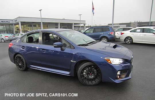 optional 18" black STI  alloy wheels, part of the 2016 WRX Sport Package, Lapis Blue shown