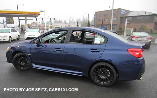 optional 18" black STI  alloy wheels, part of the 2016 WRX Sport Package, Lapis Blue shown