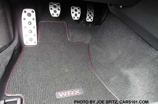 2016 WRX standard carpeted floor mat, with WRX logo, Shown with  metal covered footrest, clutch, brake, and gas pedals