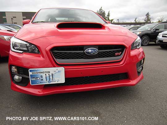 2017 Subaru WRX STI with tow-hook mounted front license plate holder. No extra holes in bumper (all come with 2 pre-drilled). This one is by Perrin Performance.