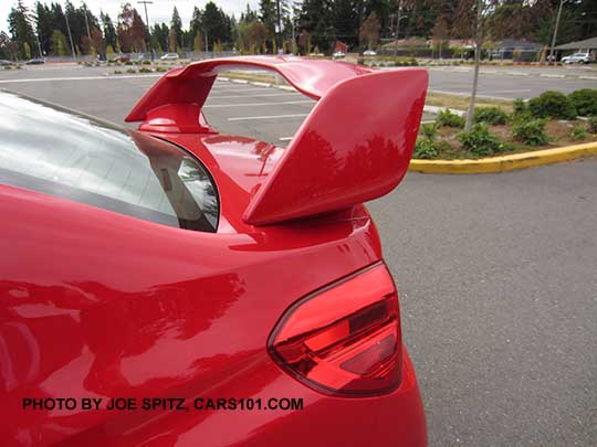 closeup of the 2017 Subaru STI tall wing spoiler, pure red shown