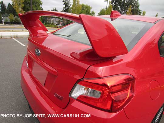 closeup of the 2017 Subaru STI tall wing spoiler, pure red shown. Standard on STI, optional on STI Limited