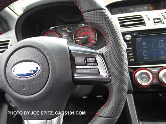 2017 Subaru STI leather wrapped steering wheel has pebbled leather hand grips, with red stitching