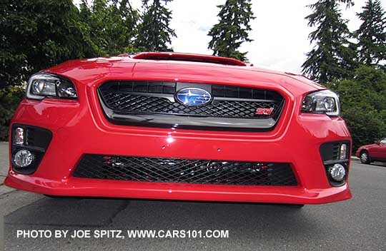 2017 Subaru WRX STI  front view with grill, fog lights, headlight. Pure Red shown