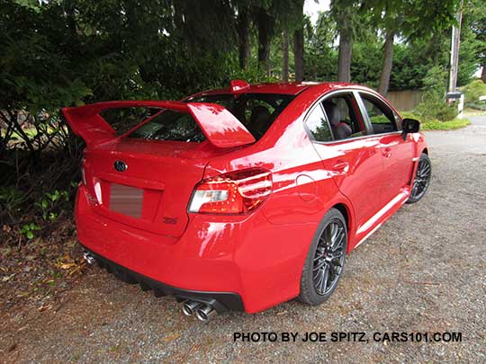 rear view 2017 WRX STI with tall wing spoiler. Red color shown.