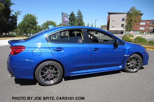 side view WR Blue 2017 WRX STI Limited with silver 18" BBS alloys, small rear trunk lip spoiler