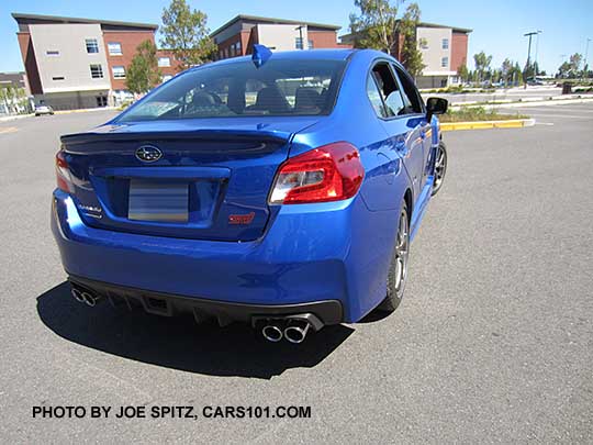rear view World Ralley Blue 2017 WRX STI Limited with the small rear trunk lip spoiler