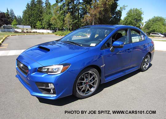 front view WR Blue 2017 WRX STI Limited with silver 18" BBS alloys, fog lights, small rear trunk lip spoiler