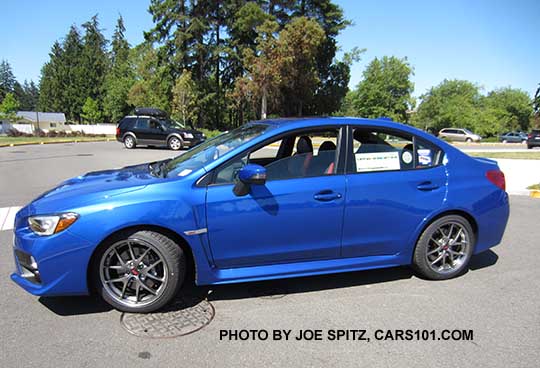 side view WR Blue 2017 WRX STI Limited with silver 18" BBS alloys, rear trunk lip spoiler