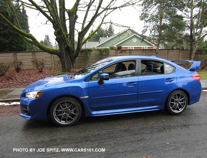 side view 2017 Subaru WRX STI Limited, tall wing spoiler, world rally blue color, with optional body side moldimgs