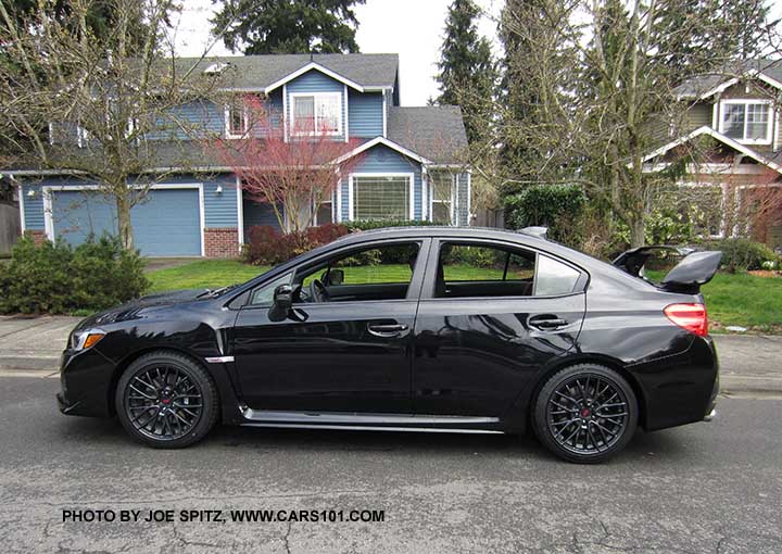 side profile view crystal black 2017 Subaru WRX STI with tall wing spoiler