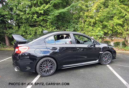 2017 Subaru WRX STI with tall wing rear spoiler, crystal black color shown