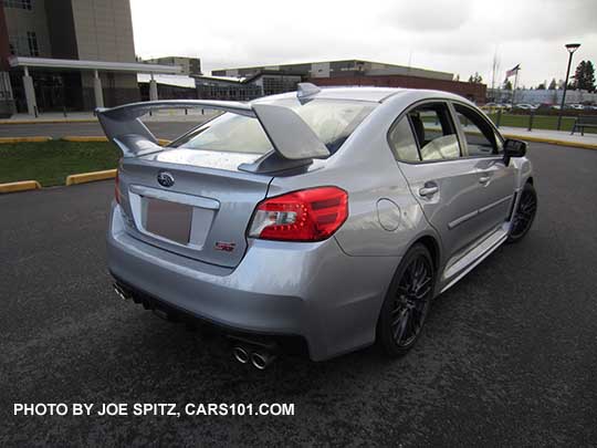 rear view  2017 Subaru WRX STI with tall wing rear spoiler, ice silver color with optional side moldings