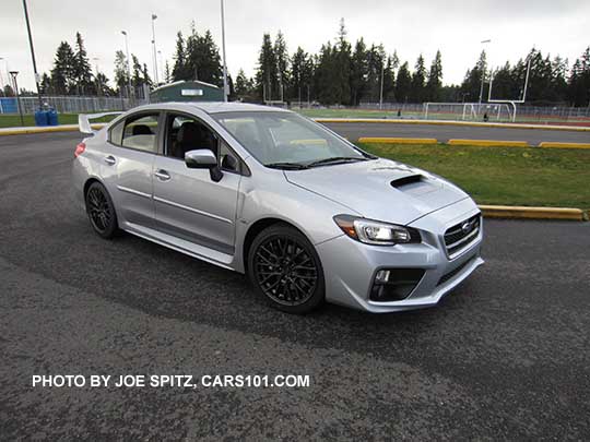 ice silver 2017 Subaru WRX STI with tall wing rear spoiler, and optional body side moldings