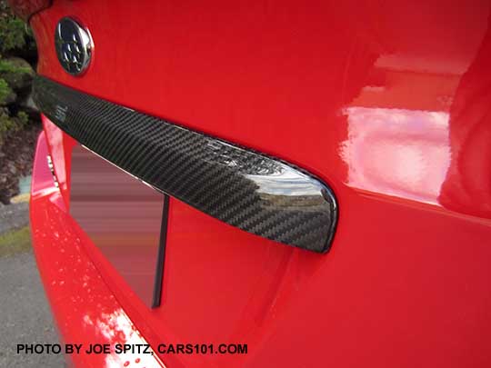 2017 WRX with optional carbon fiber trunk trim, Pure red car