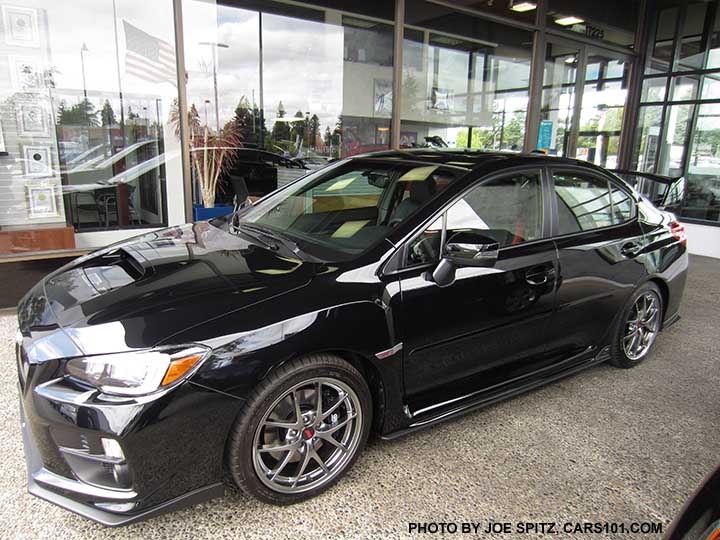 2017 Subaru WRX STI with front lip, side and rear underspoilers, dealer installed. Black STI Limited shown with 18" BBS silver alloys.