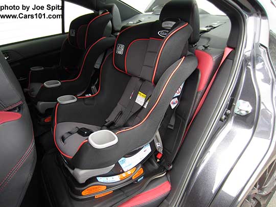 2018 Subaru WRX and STI with 2 child seats in the back seat, using lower anchor and tether LATCH system. STI shown.