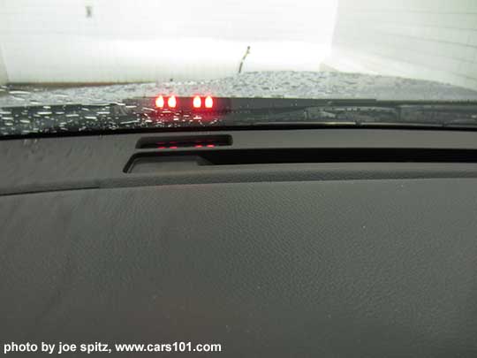 2018 Subaru WRX Eyesight Assist Monitor shines small lights on the lower windshield in in front of the driver. The 4 red lights flashing indicate DANGER- that an obstacle is detected, or pre-collision braking has been activated etc.