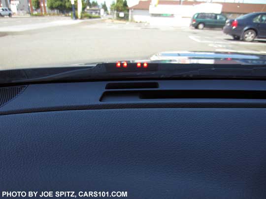 2018 Subaru WRX Eyesight Assist Monitor shines small lights on the lower windshield in in front of the driver. The 4 red lights flashing indicate DANGER- that an obstacle is detected, or pre-collision braking has been activated etc.