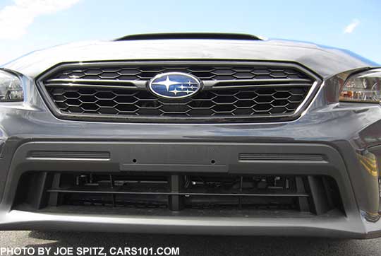 closeup of the new 2018 Subaru WRX front grill with front bumper fascia air intake outside trim