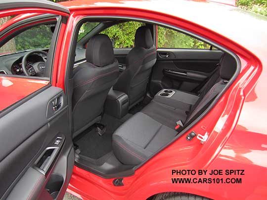 2018 Subaru WRX Premium rear seat with armrest and cupholders, pure red car shown