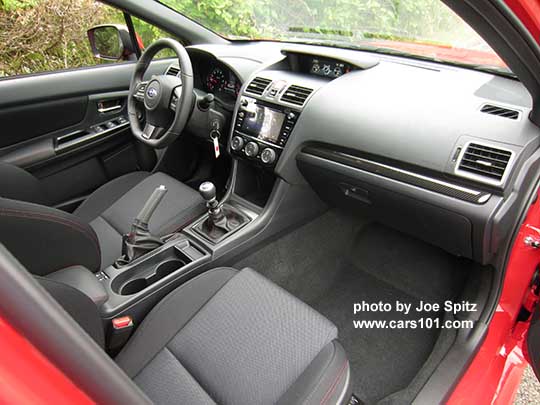 2018 Subaru WRX Premium dashboard and center console, black cloth interior from passenger side