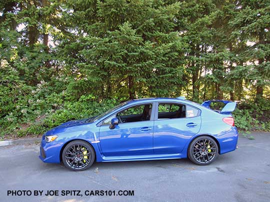 2018 Subaru WRX STI  Limited with tall wing spoiler,  WR Blue color shown.